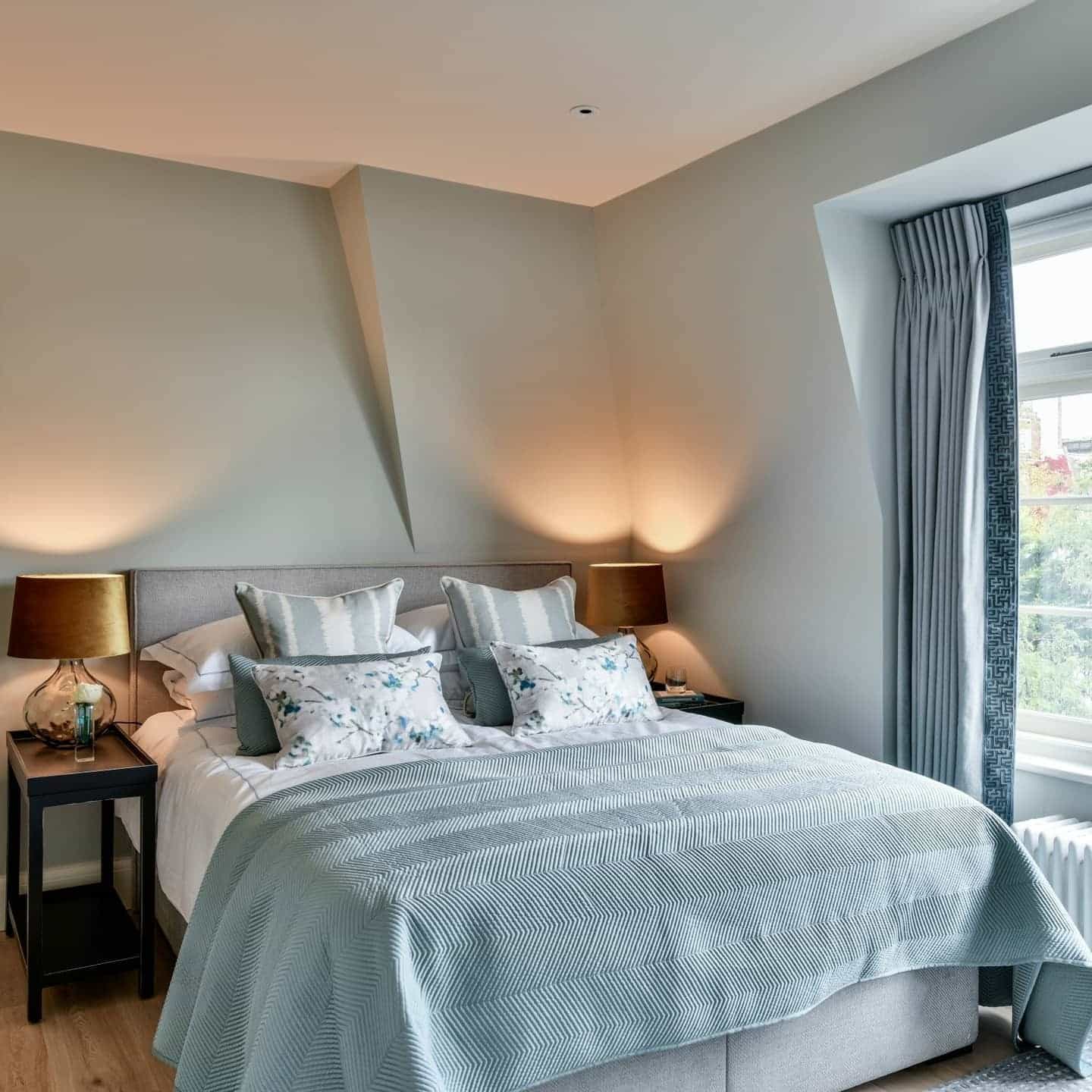 20. Refined Light Blue Bedroom with Subtle Patterned Textiles - light blue bedroom ideas