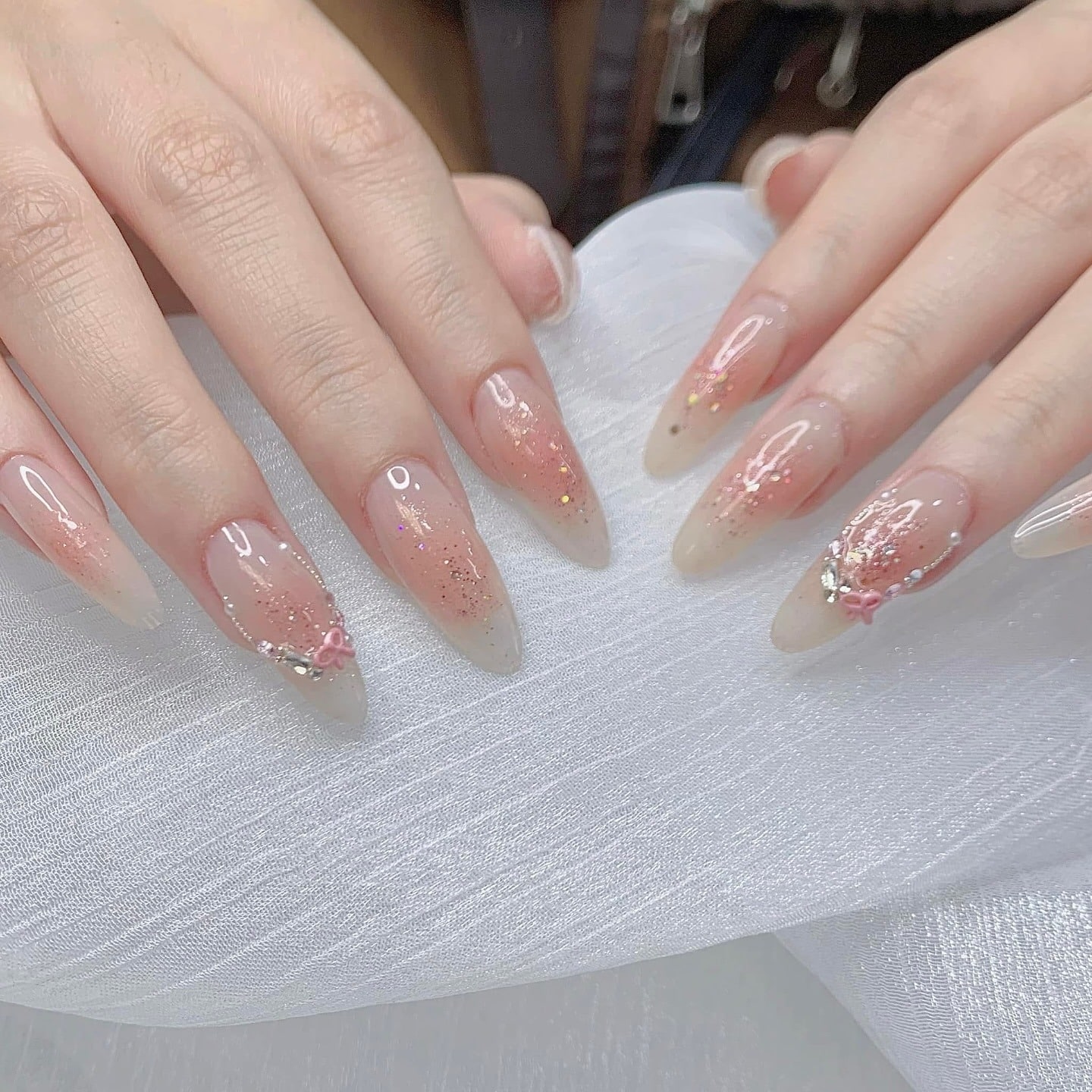 7. Sheer Pink Glitter Ombre Almond Nails - basic nail ideas