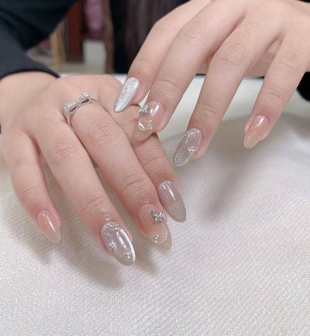 8. Blush Nude with Silver Charm Details - basic nail ideas