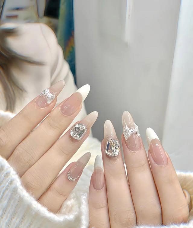 10. Milky White French with Crystal Embellishments - basic nail ideas
