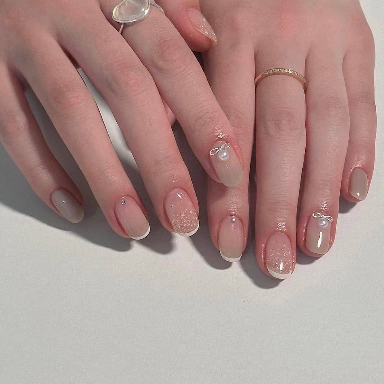 11. Soft Blush French with Pearl Accent Nails - basic nail ideas