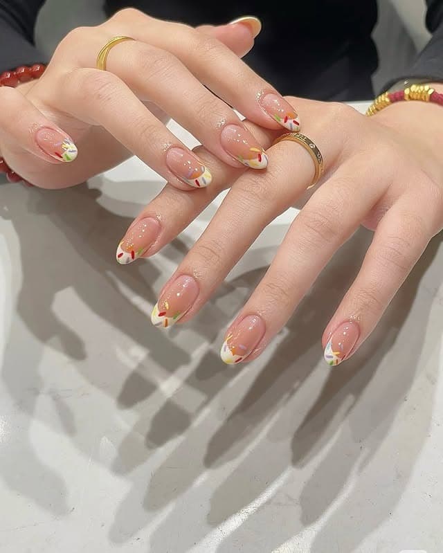 12. Nude French Tips with Colorful Confetti Detail - basic nail ideas