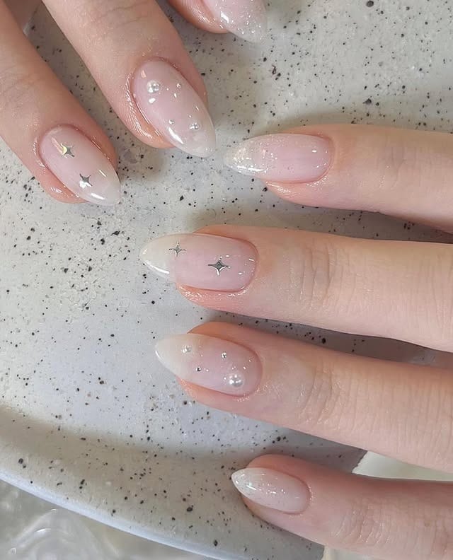 18. Sheer Pink Almond Nails with Star and Crystal Accents - basic nail ideas