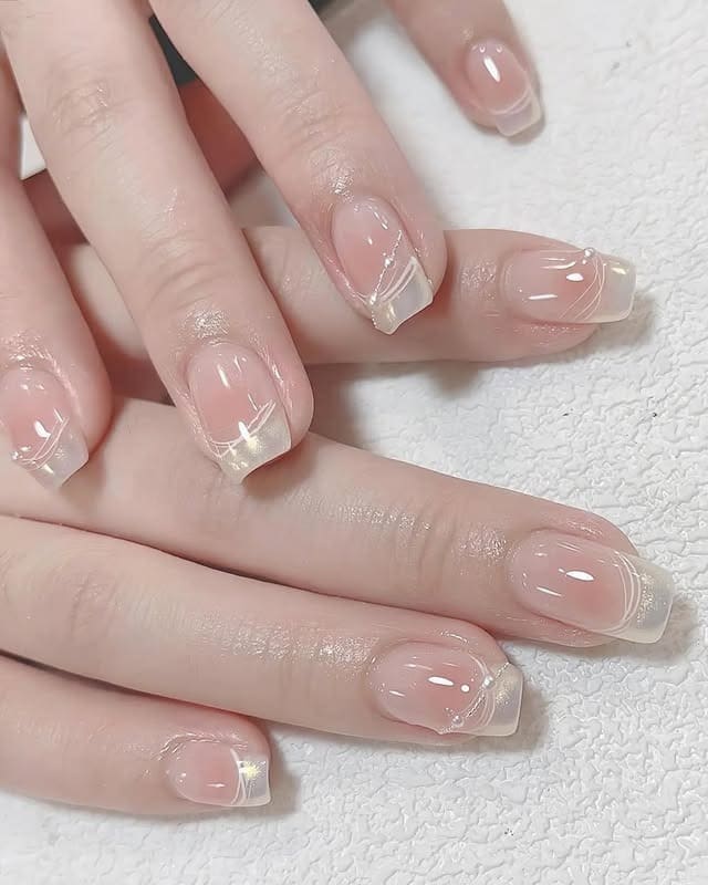 20. Glossy Nude Square Nails with Fine White Line Detail - basic nail ideas