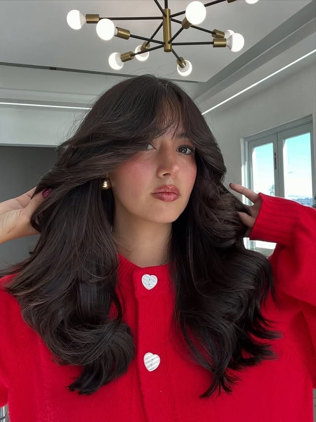 1. Voluminous Chocolate Waves with Wispy Bangs - Wispy Bangs For Wavy Hair