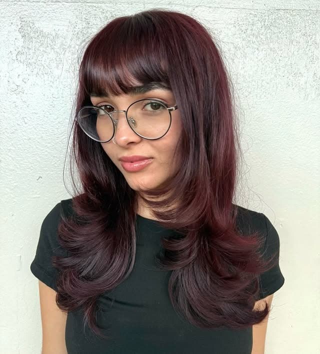 13. Deep Burgundy Layers with Soft Wispy Fringe - Wispy Bangs For Wavy Hair