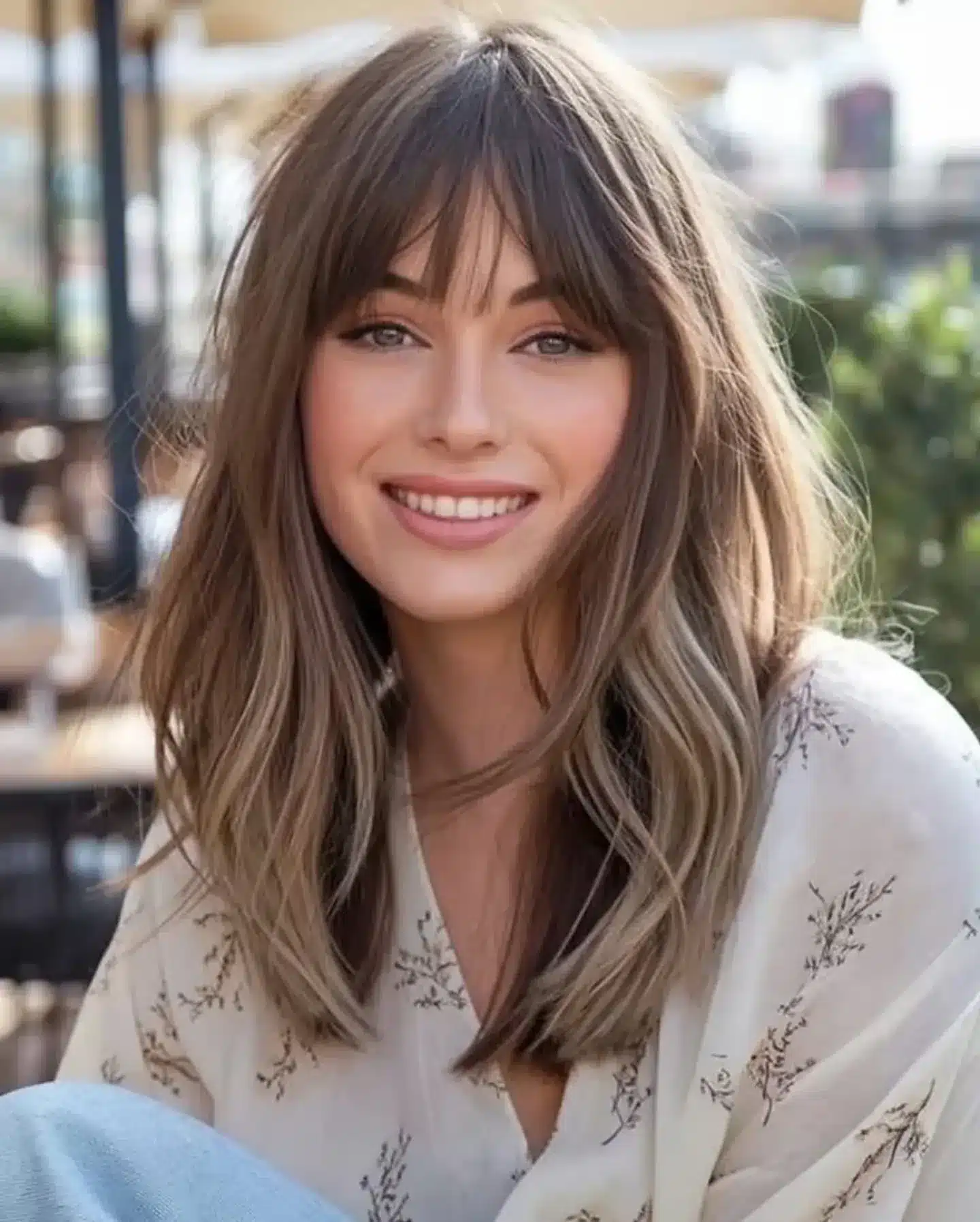 15. Sandy Beige Waves with Piecey Wispy Bangs - Wispy Bangs For Wavy Hair