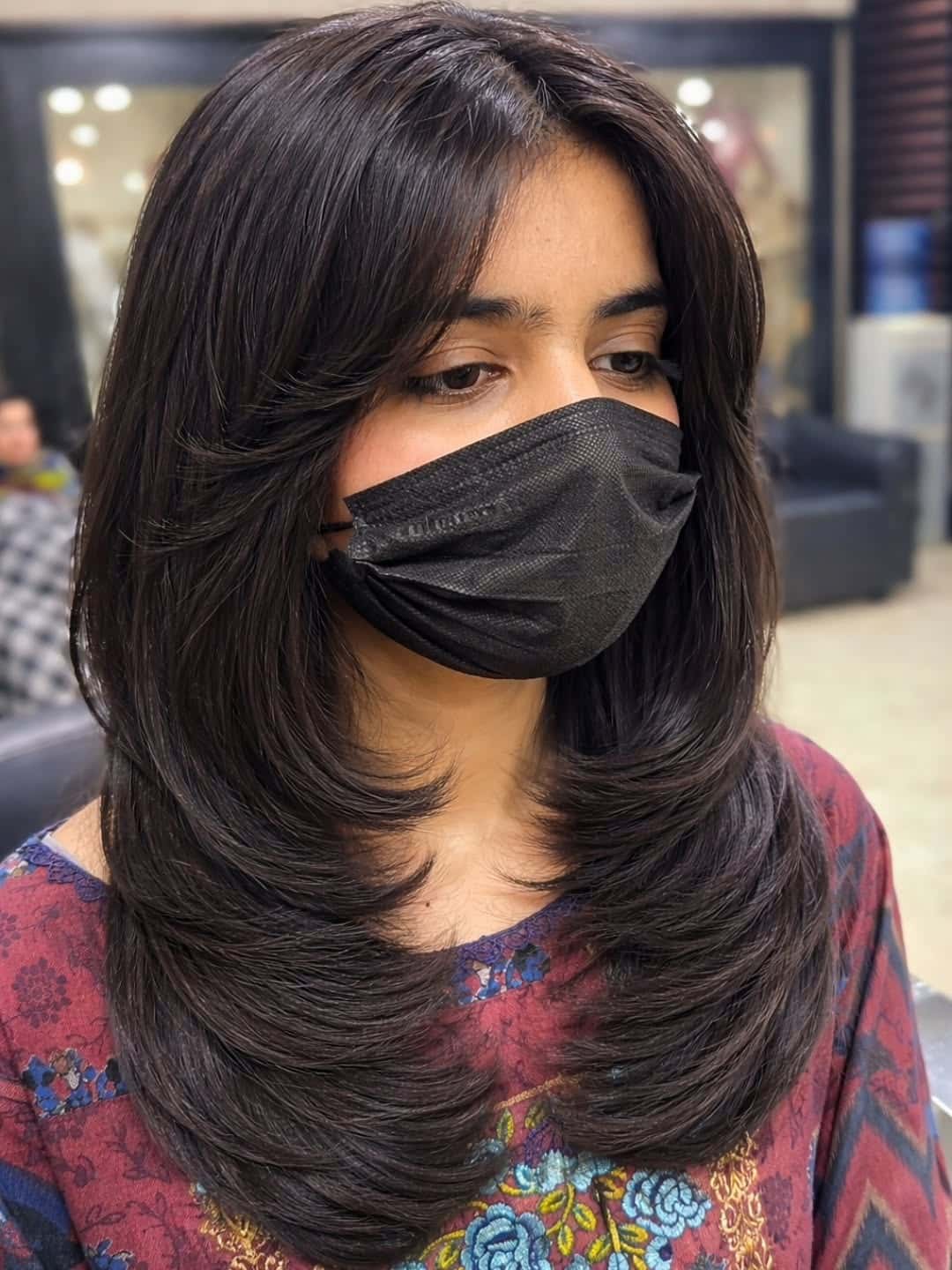 16. Glossy Dark Brunette Layers with Curtain Wispy Bangs - Wispy Bangs For Wavy Hair