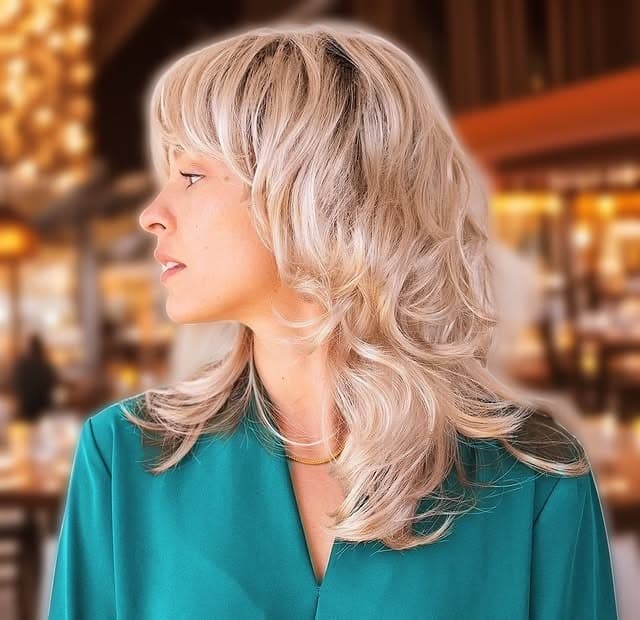 13. Platinum Blonde Shag with Feather Fringe Detailing - Feather Fringe Hair