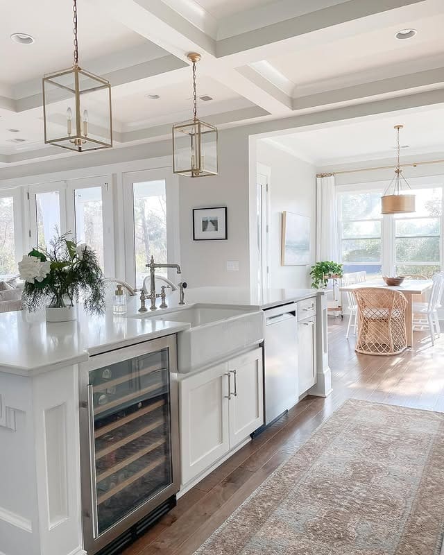 8. Elegant White Galley Kitchen with Glass Accents - galley kitchen ideas