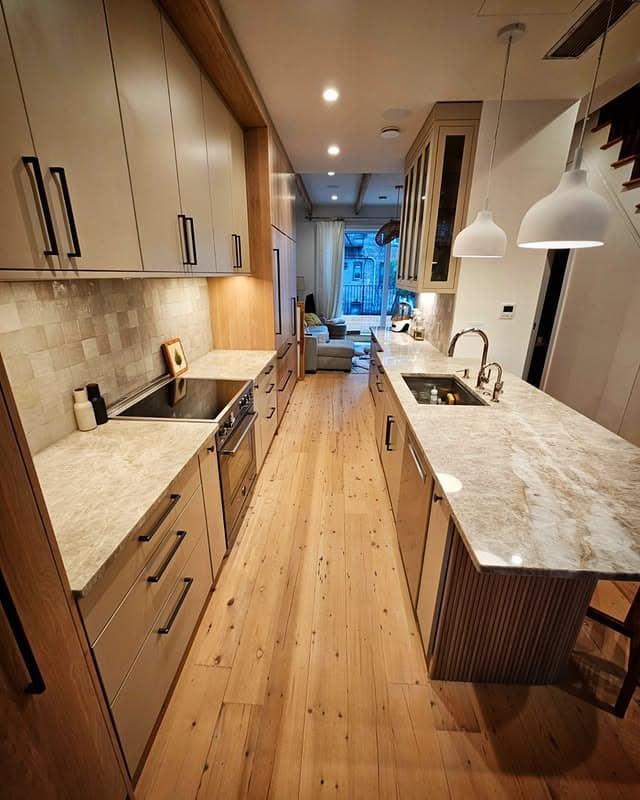 9. Contemporary Galley Kitchen with Light Wood and Stone Surfaces - galley kitchen ideas