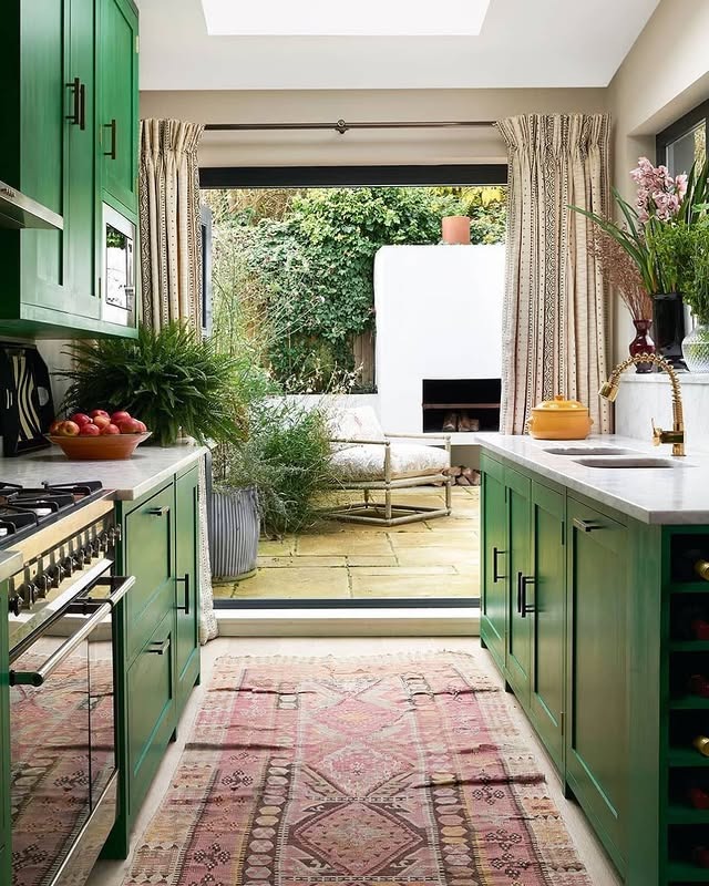 13. Deep Green Galley Kitchen with Garden Connection - galley kitchen ideas