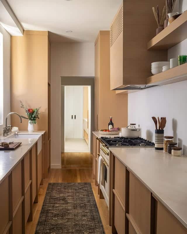 18. Warm Beige Galley Kitchen with Minimal Detailing - galley kitchen ideas