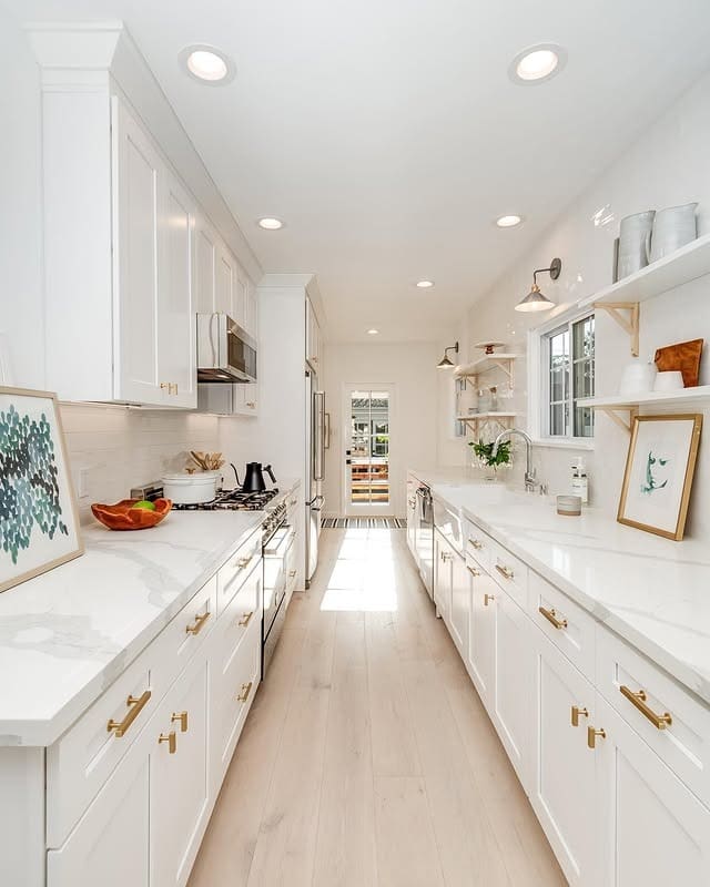 21. Bright White Galley Kitchen with Brass Hardware and Open Shelving - galley kitchen ideas