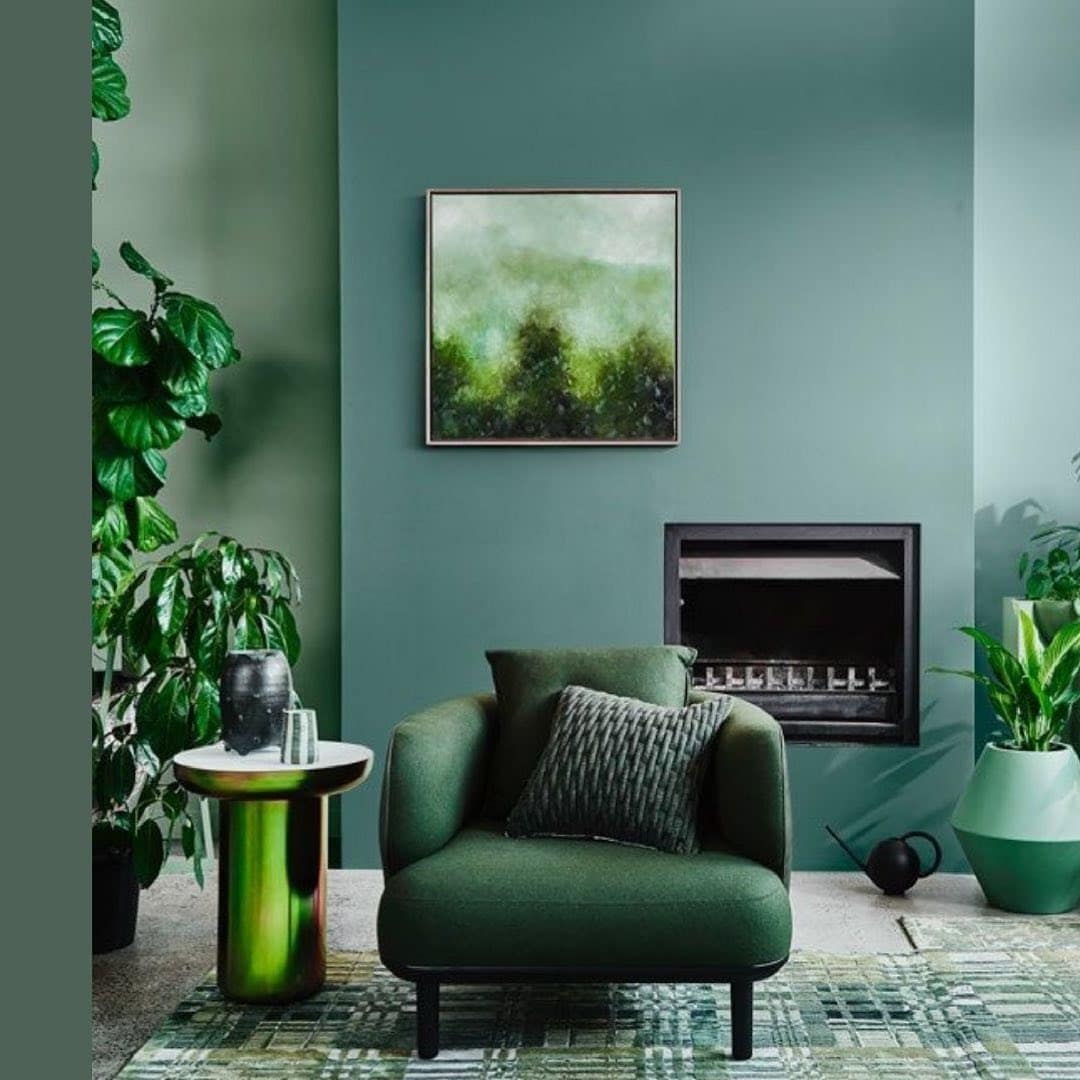 11. Monochromatic Emerald Corner with Botanical Accents - emerald green living room ideas
