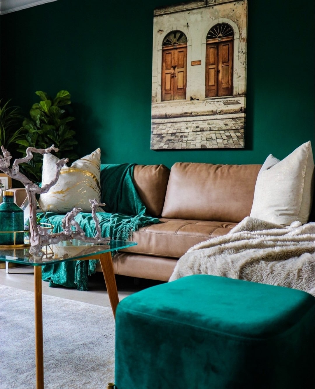 16. Emerald Accent Wall with Neutral Leather Contrast - emerald green living room ideas