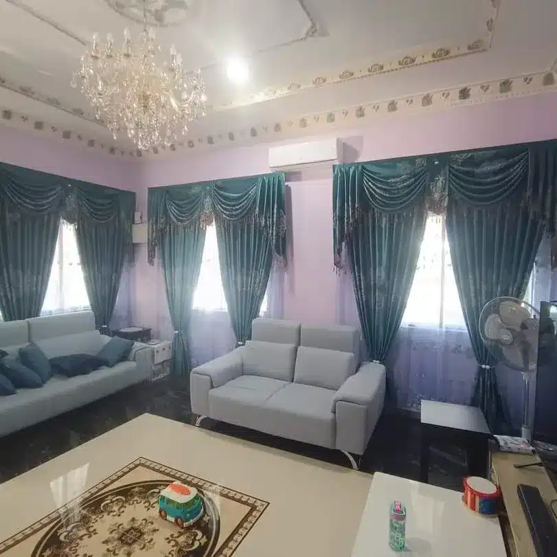 17. Emerald Drapery with Classic Living Room Elegance - emerald green living room ideas