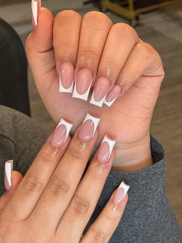 4. Classic Soft Pink Deep French Curve - french tip nail ideas