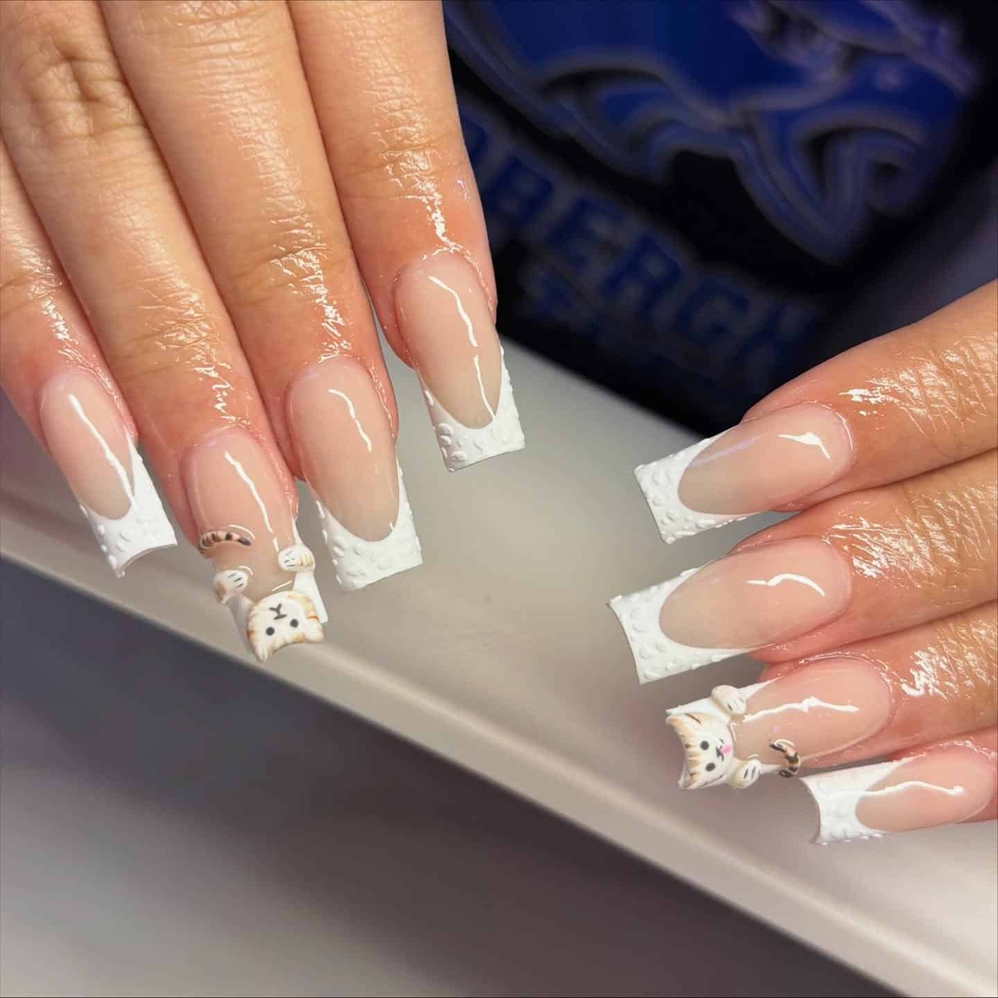 7. Textured White French with 3D Accent Art - french tip nail ideas