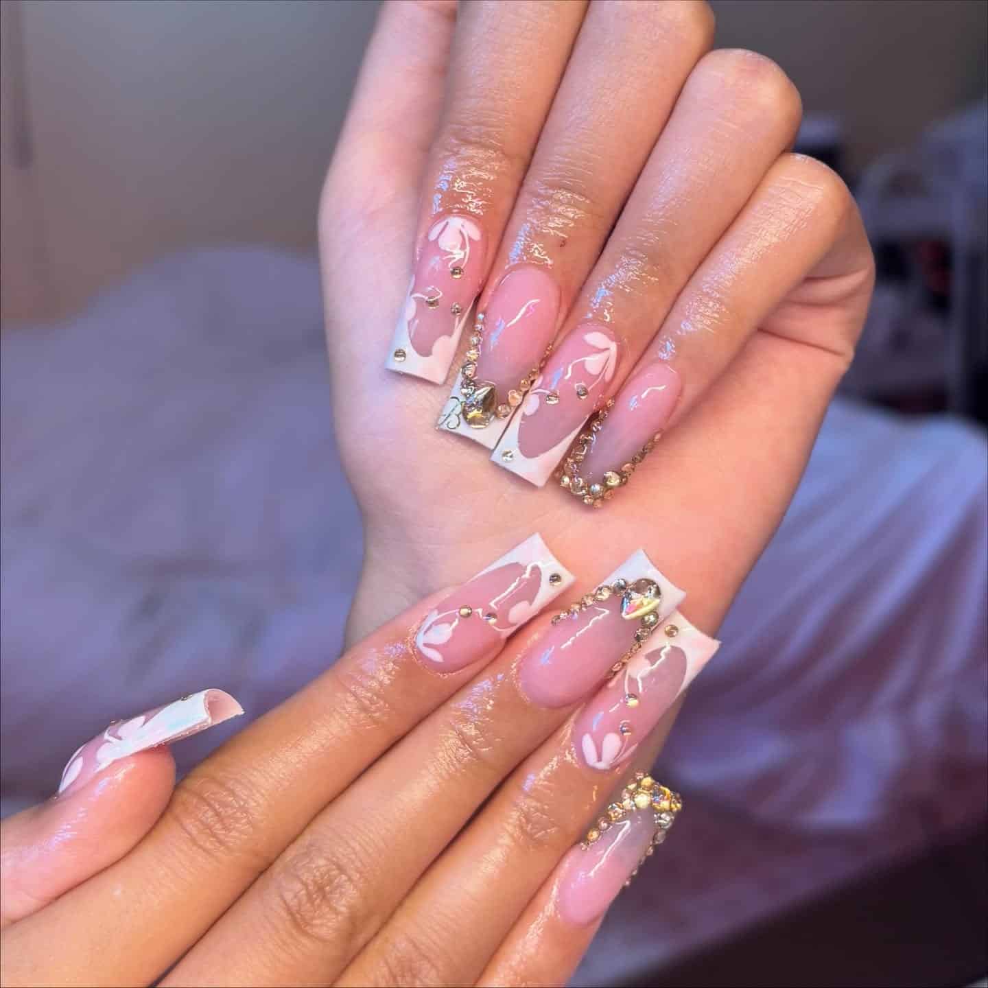 8. Pink French Tips with Crystal Detailing - french tip nail ideas