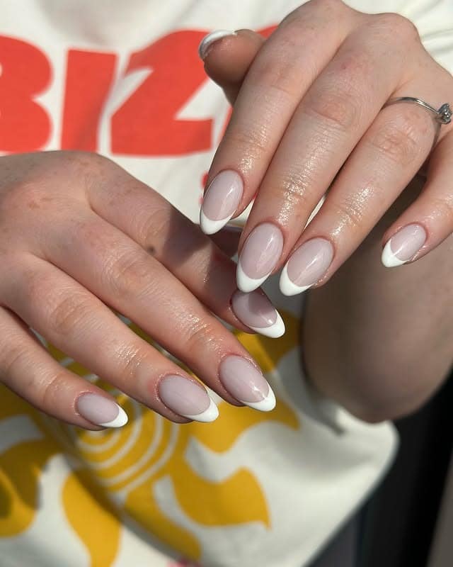 13. Soft Nude Almond Classic French Tip - french tip nail ideas