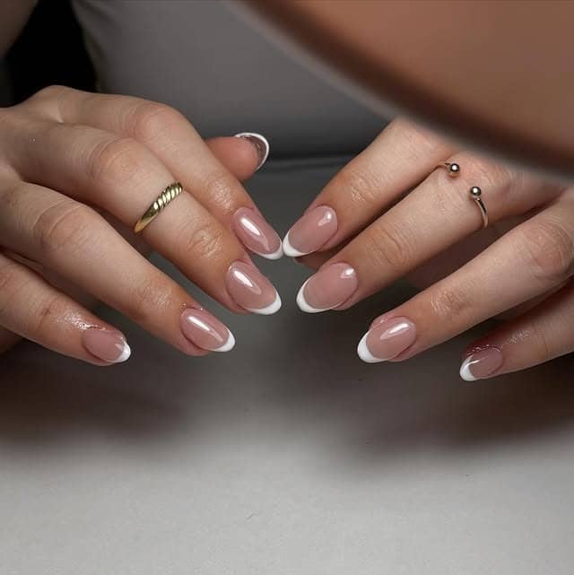 22. Classic Nude Almond French Tip with Gloss Finish - french tip nail ideas