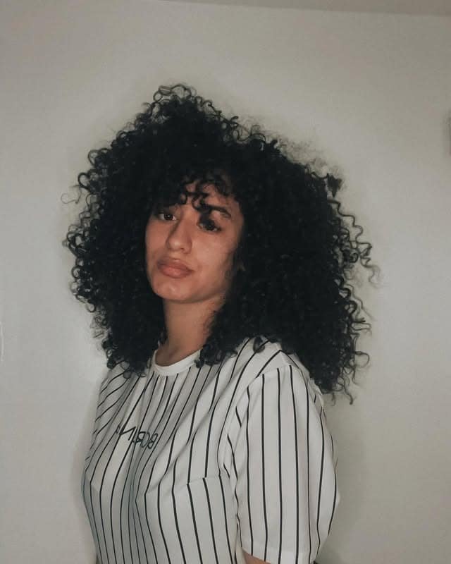 7. Voluminous Black Curly Afro - Messy Curly Hair