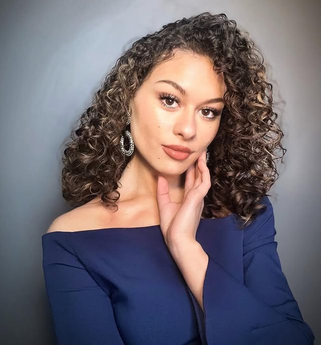 12. Defined Brunette Ringlets with Subtle Highlights - Messy Curly Hair