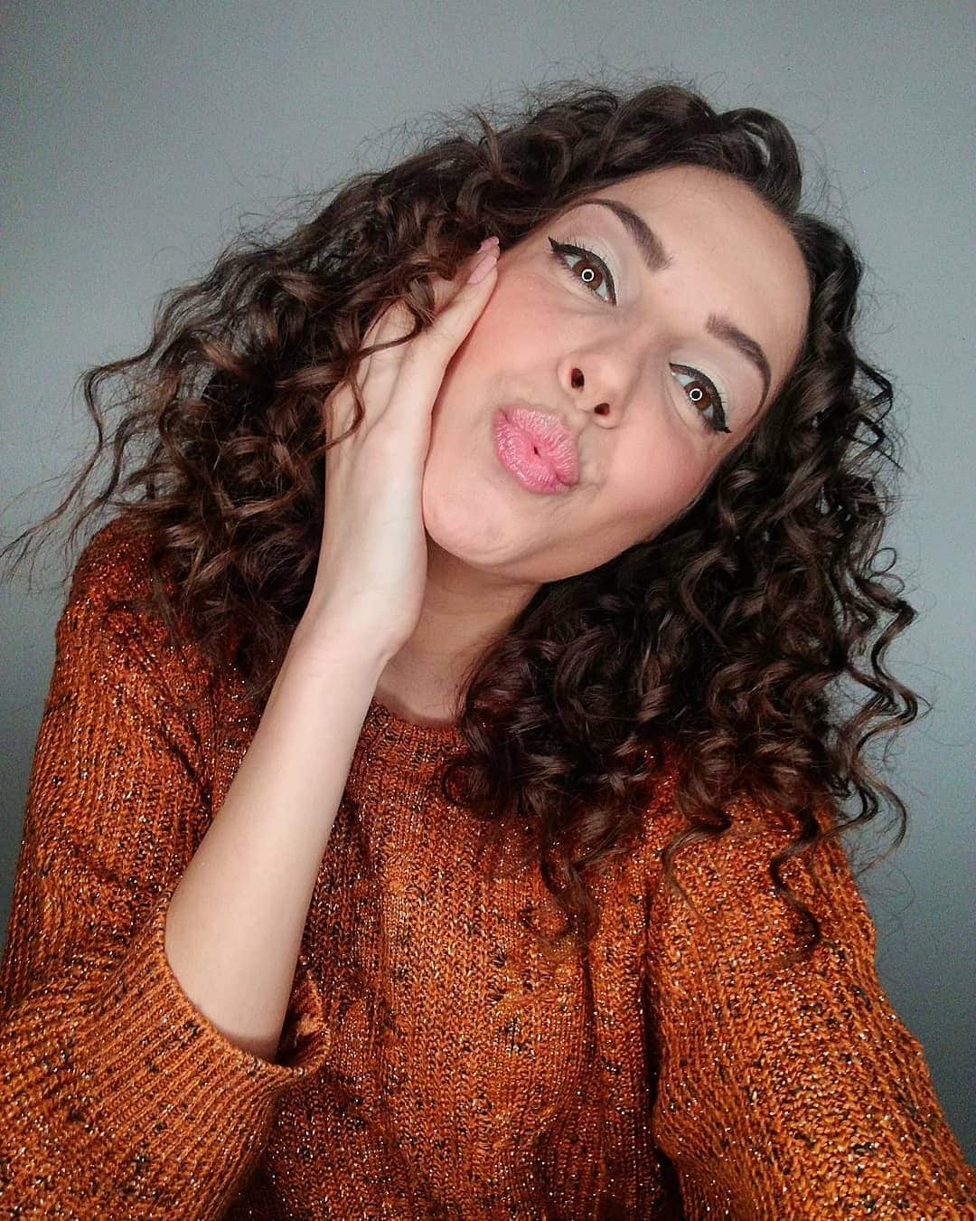 17. Classic Medium-Length Brunette Spiral Curls - Messy Curly Hair