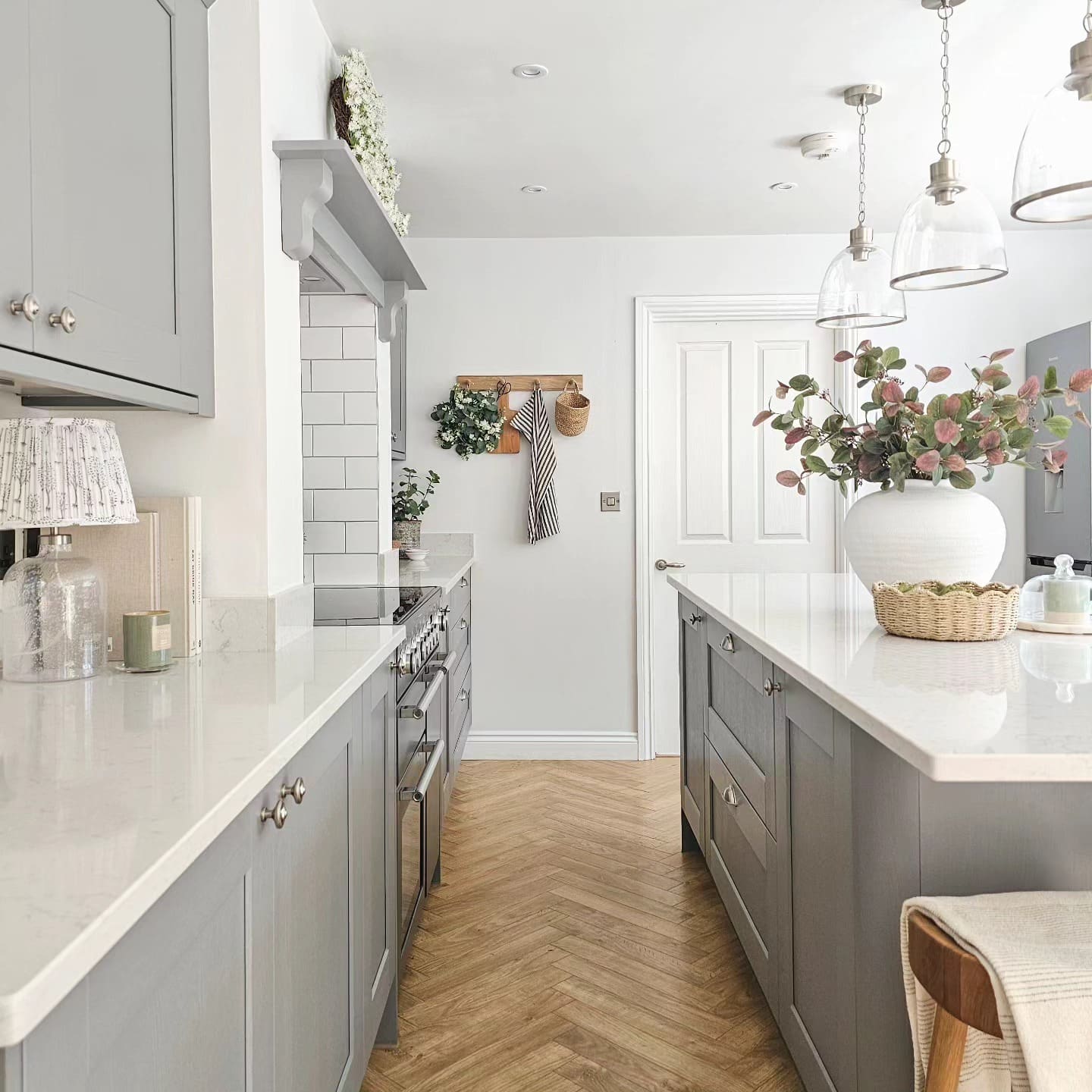 8. Modern Country Kitchen with Grey Cabinetry and Herringbone Flooring - country style kitchen ideas