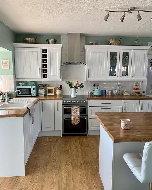 10. Fresh Country Kitchen with Mint Green Walls and Coordinated Decor - country style kitchen ideas