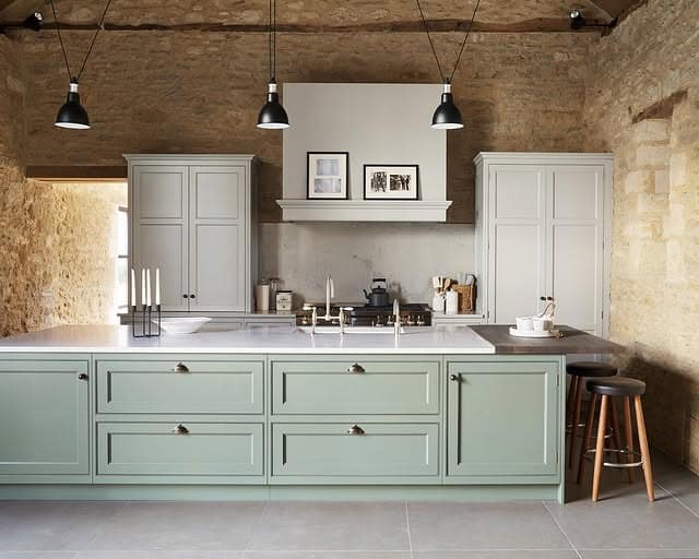 11. Rustic Stone Country Kitchen with Sage Green Island - country style kitchen ideas
