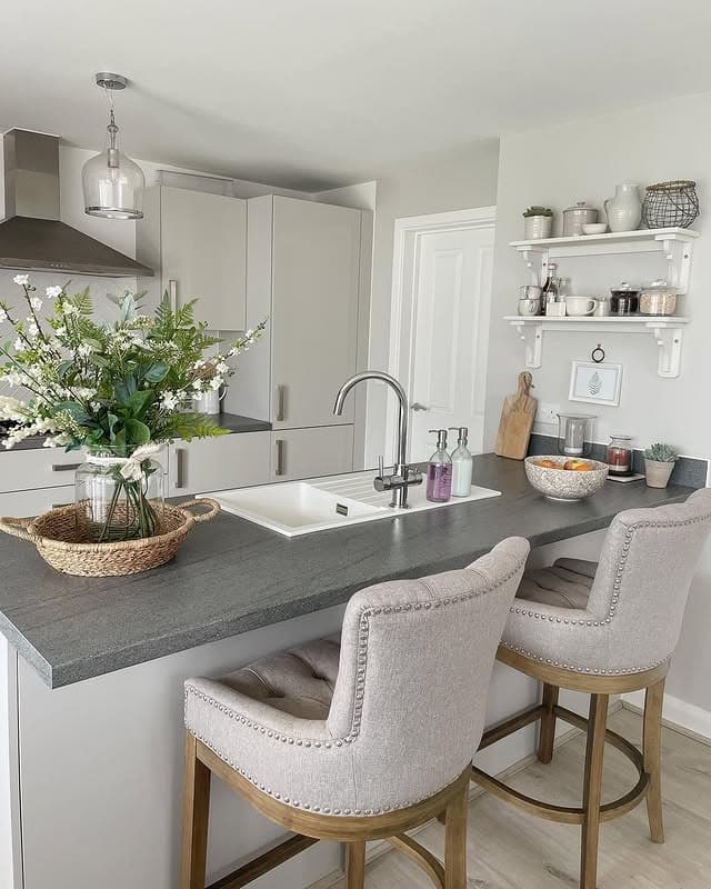 12. Soft Neutral Country Kitchen with Grey Countertops and Upholstered Seating - country style kitchen ideas
