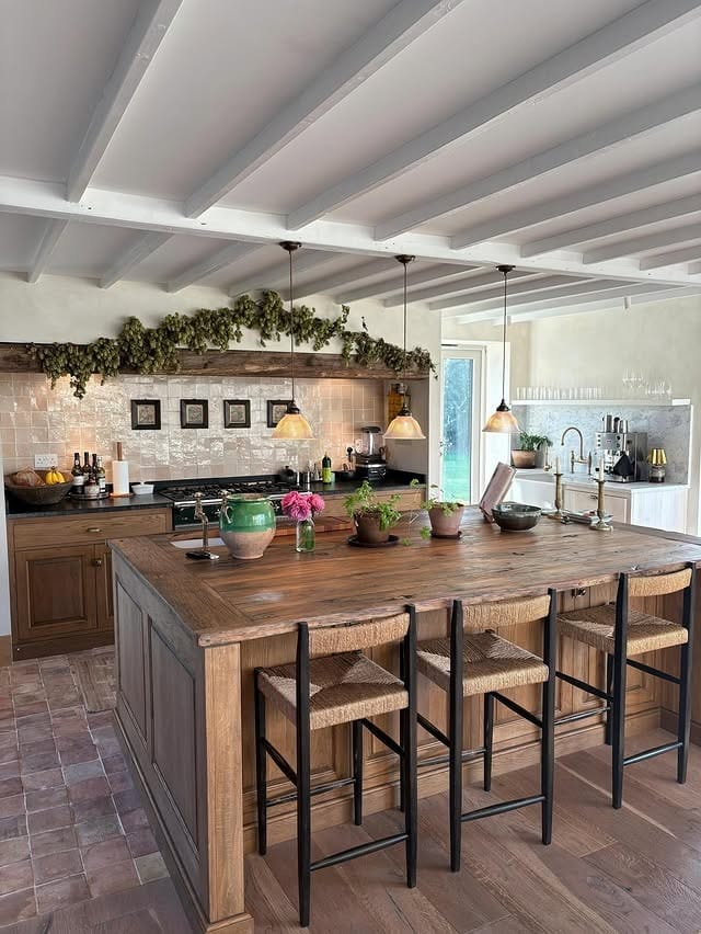 16. Warm Wood Country Kitchen with Exposed Beams and Neutral Tile Backsplash - country style kitchen ideas