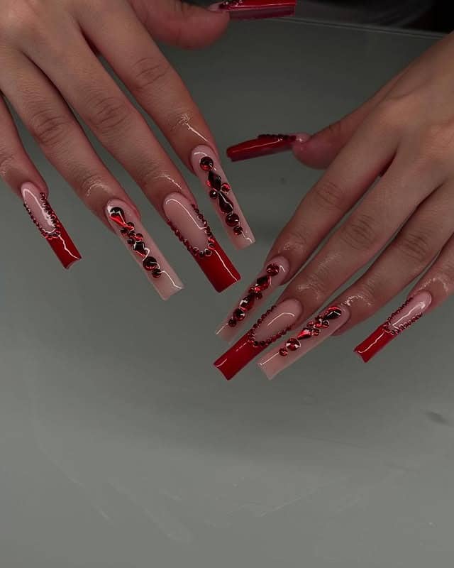 2. Nude and Red French Tip Nails with Rhinestone Trails - red prom nail ideas