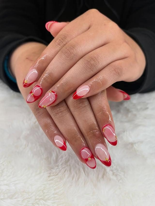 3. Almond Red French Tips with Minimal Gold Detailing - red prom nail ideas