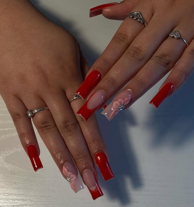 4. Red and Nude Coffin Nails with Floral Embellishments - red prom nail ideas