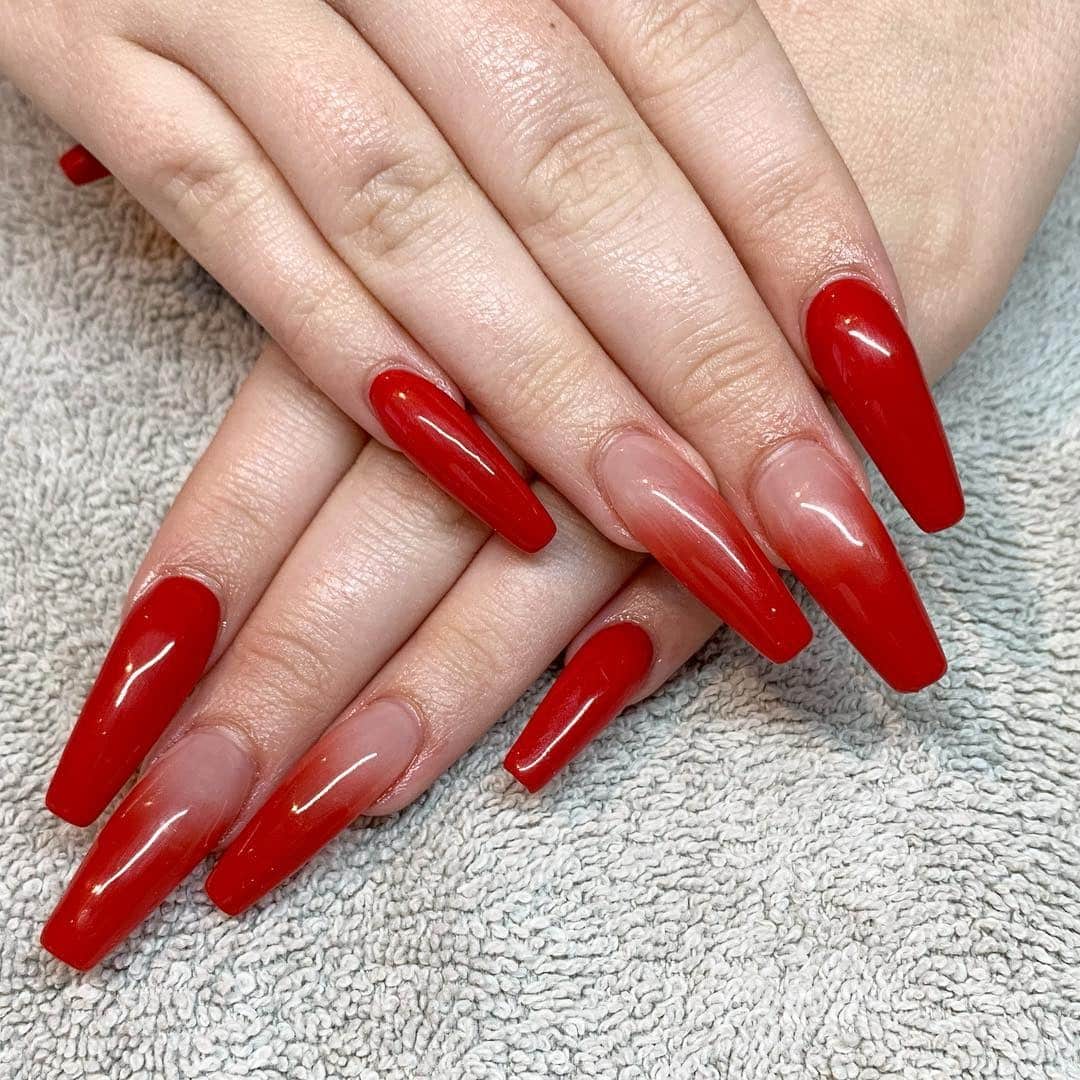 6. Red Ombre Coffin Nails with High-Gloss Finish - red prom nail ideas