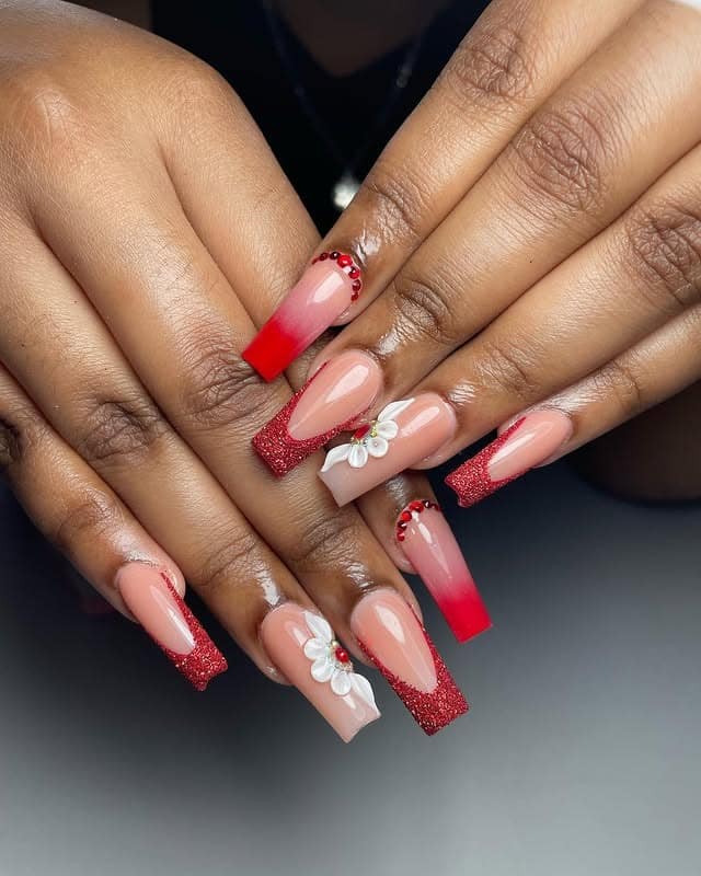 8. Soft Red Ombre Nails with Floral Accent and Rhinestones - red prom nail ideas