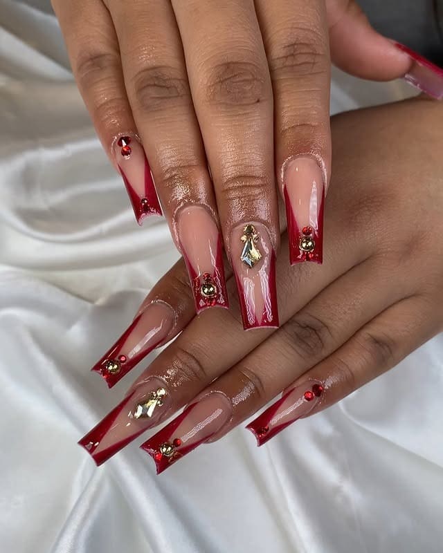 14. Red Ombre Coffin Nails with Gold Charms and Crystal Details - red prom nail ideas