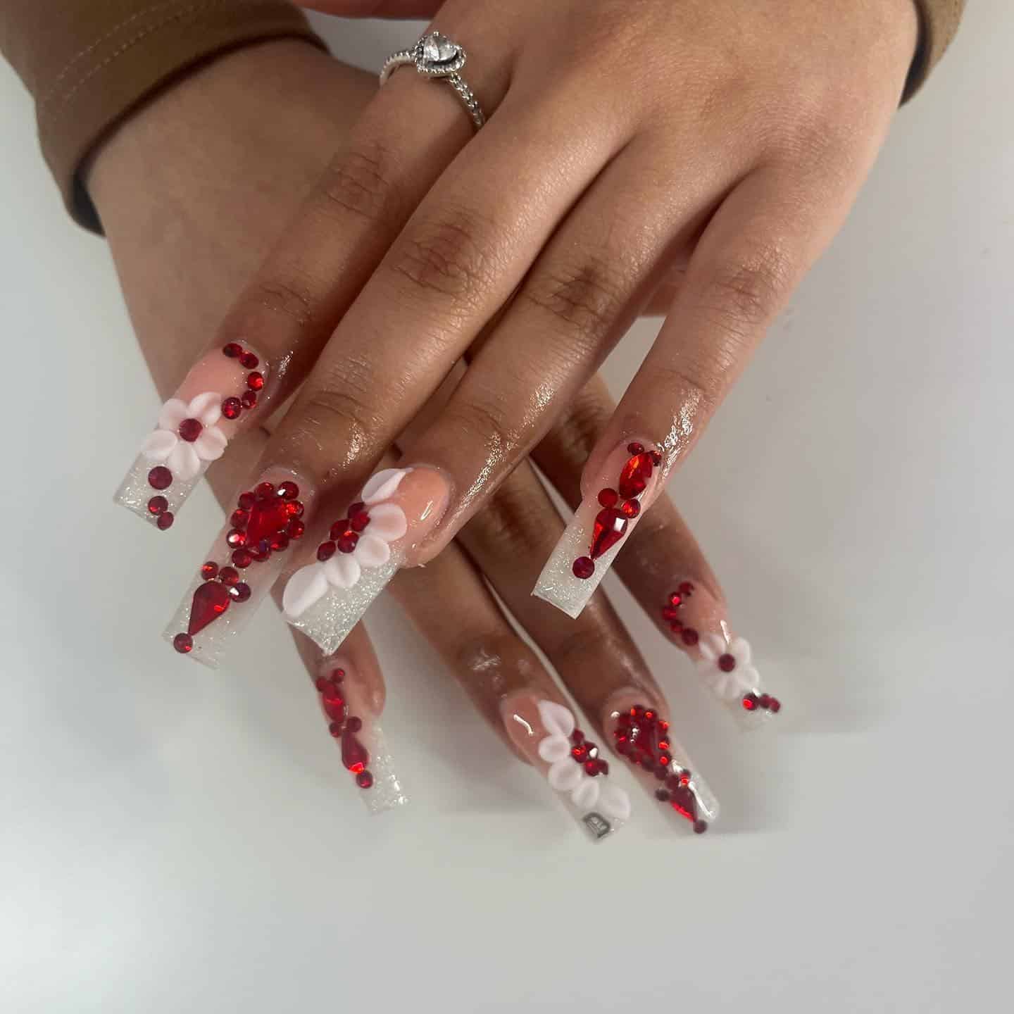 17. White and Red Glitter Coffin Nails with Rhinestone Clusters and Floral Art - red prom nail ideas