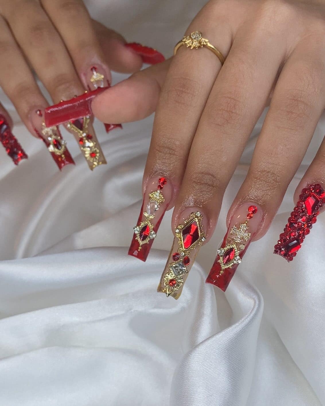 18. Red and Gold Embellished Coffin Nails with Statement Crystal Design - red prom nail ideas
