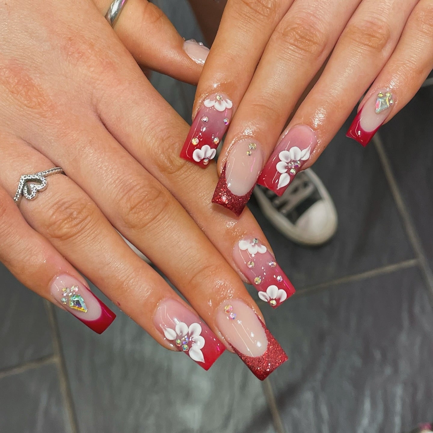 20. Red Ombre and Glitter Coffin Nails with Floral and Crystal Accents - red prom nail ideas
