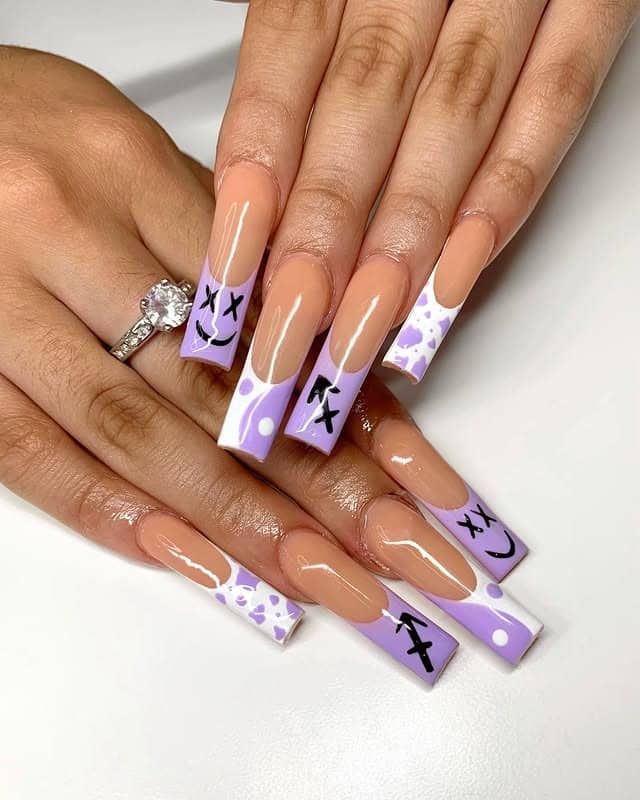 1. Lavender French Tip Coffin Nails with Graphic Accents - purple and lavender nail ideas