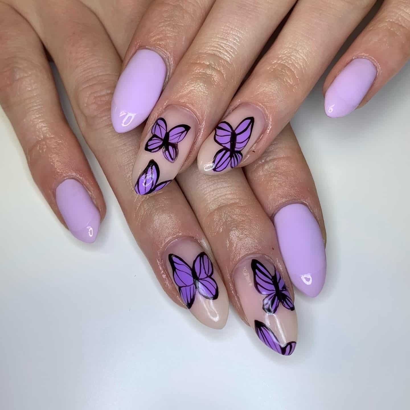 8. Matte Lavender Nails with Butterfly Art Accents - purple and lavender nail ideas