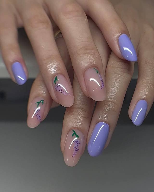 10. Glossy Lilac Nails with Subtle Fruit-Inspired Accents - purple and lavender nail ideas