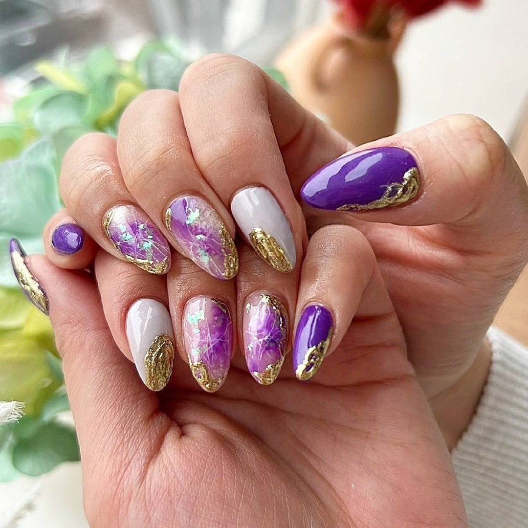 11. Purple Marble Almond Nails with Gold Foil Edges - purple and lavender nail ideas