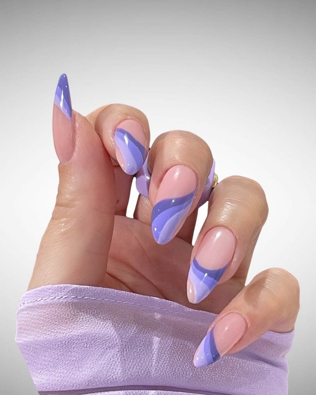 20. Lavender Swirl Almond Nails with Abstract French Design - purple and lavender nail ideas