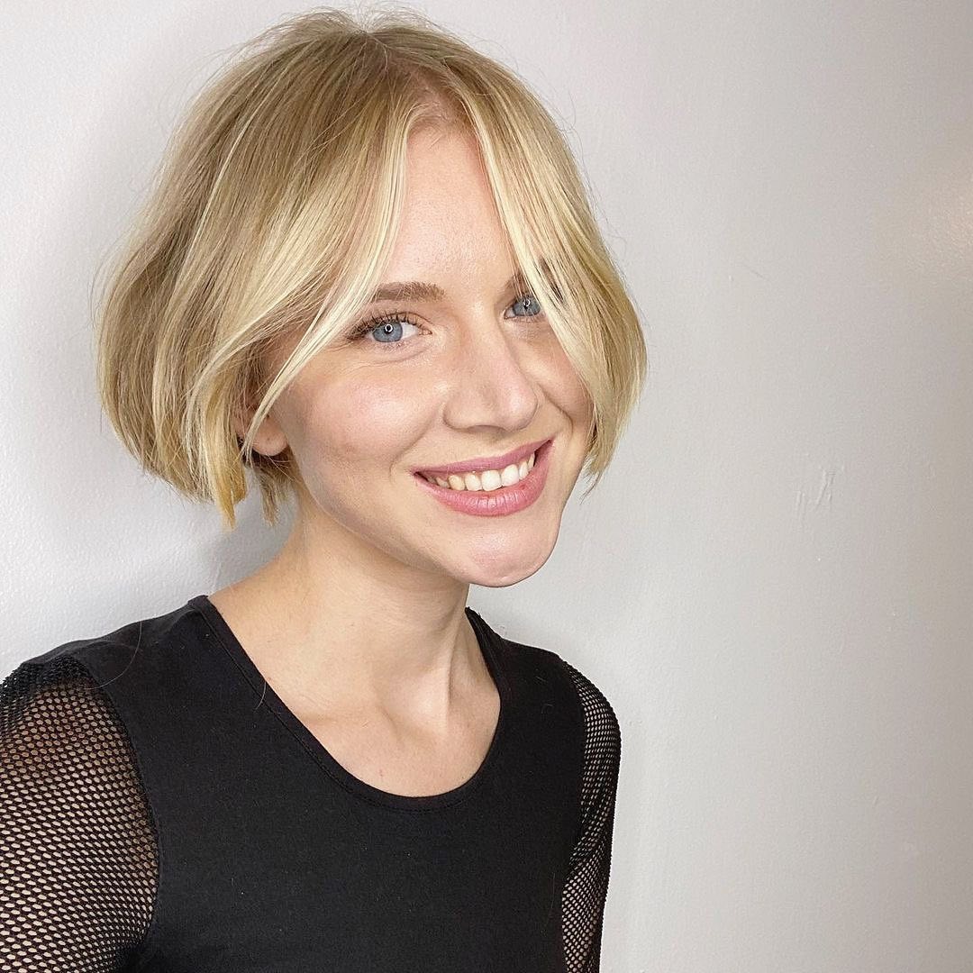 10. Soft Blonde Center-Parted Ear-Length Bob - Ear Length Bob