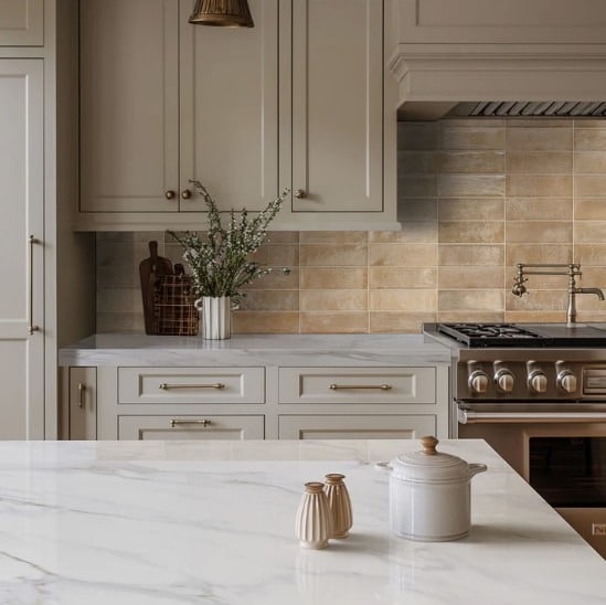 1. Soft Beige Subway Tile with Classic Cream Cabinetry - kitchen tile ideas
